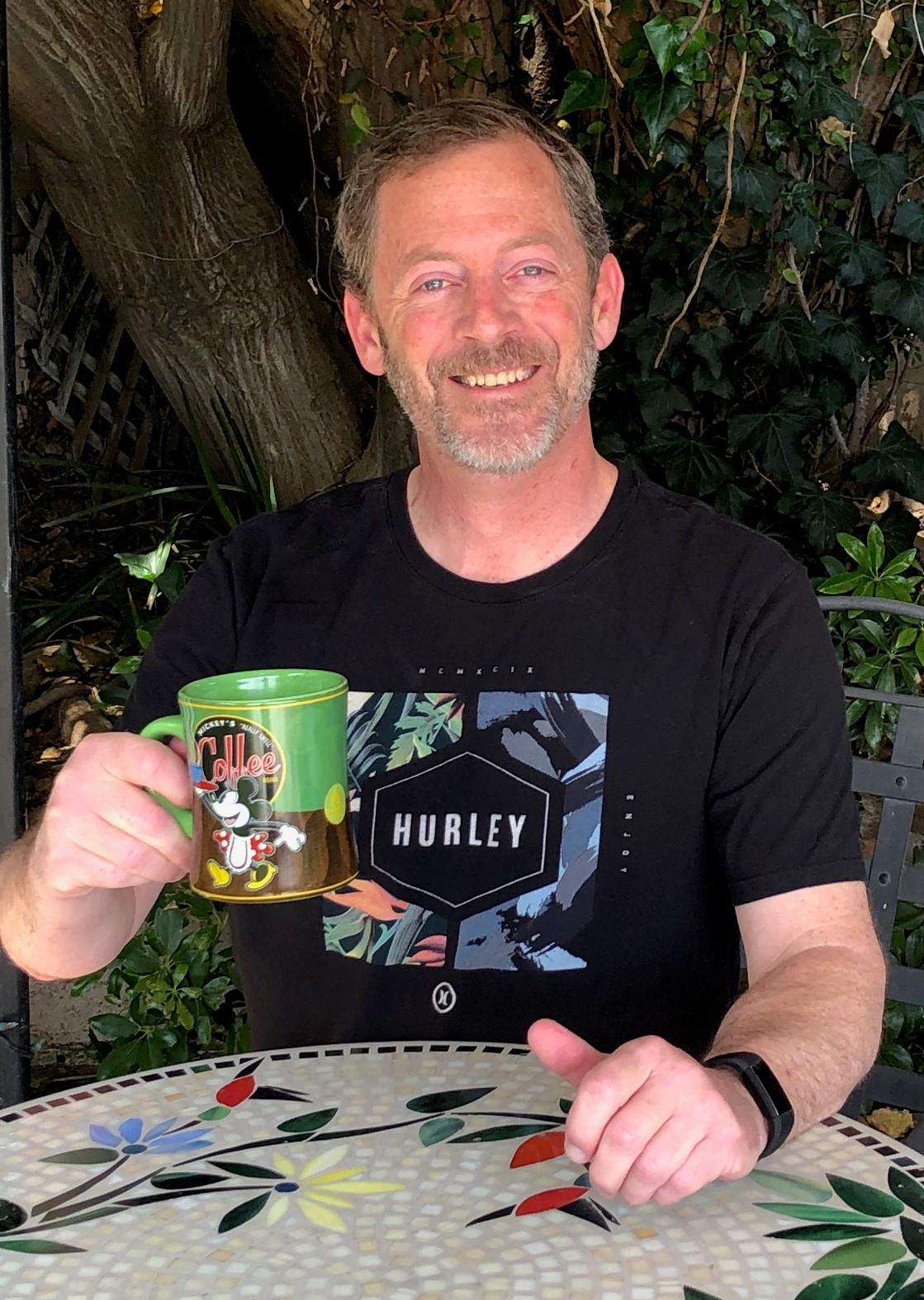 Profile picture of Mr. Caldwell holding a coffee cup